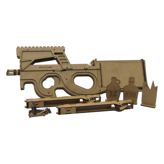 A wooden rubber band gun modeled after the P90, displayed with its full set of accessories including three themed wooden targets (a jug with a skull symbol, a bottle marked 'XXX', and a flame-shaped target), as well as two removeable magazines and an adjustable red dot sight laid out in front.